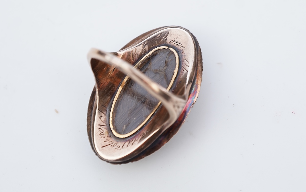 A fine George III seed pearl, enamel and diamond mourning ring, circa 1782